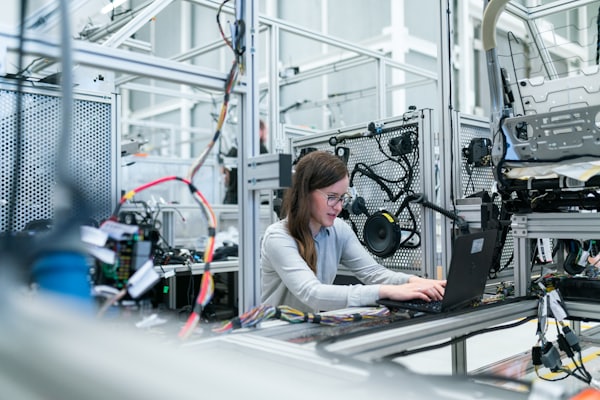 Technician working inside a manufacturing facility